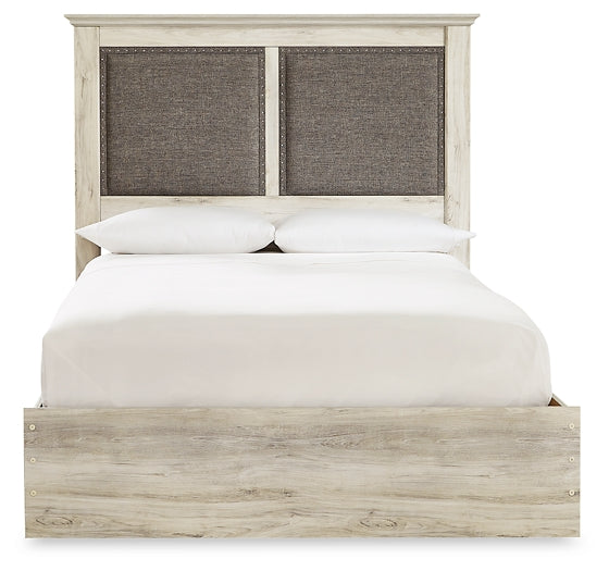 Cambeck King Upholstered Panel Bed with Mirrored Dresser